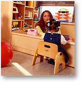 child and attendant in the playroom