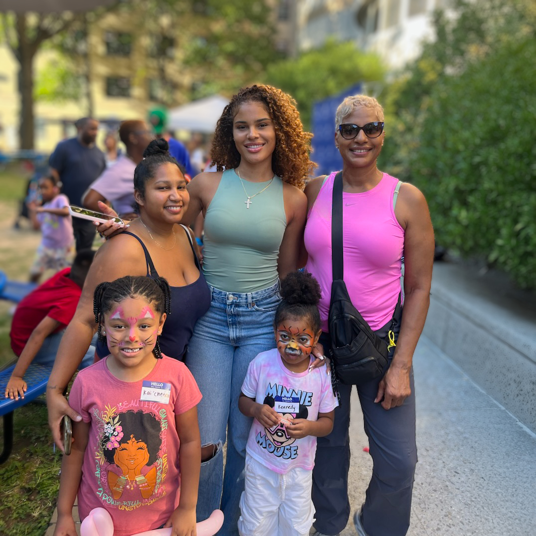 three adult women with two children