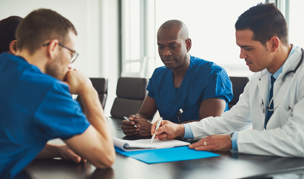 photo of people sitting at table