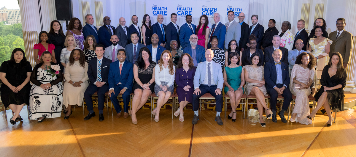 large group photo of seated and standing attendees from Schneps Media Healthcare Heroes event