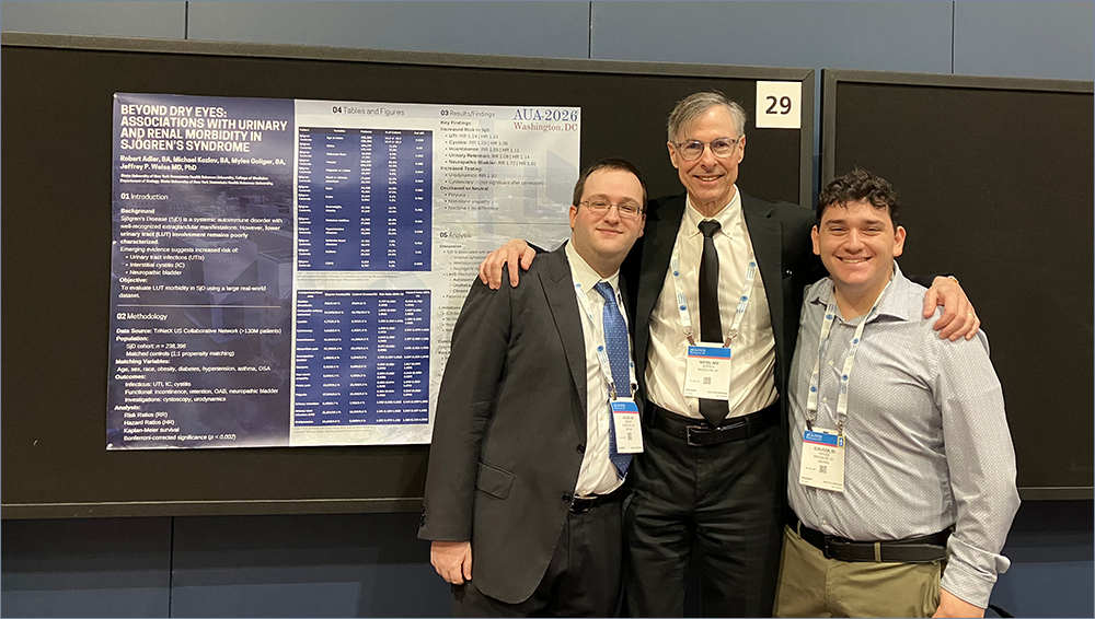Dr. Weiss poses with College of Medicine students Robert Adler MS4 and Myles Goliger MS3 in front of their research poster at AUA 2026.