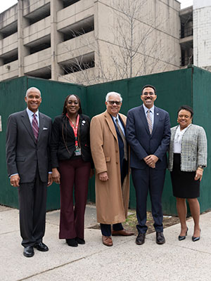 Chancellor King in front of Garage