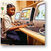 child sitting in front of a computer