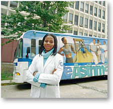 Sophiz Williams standing in front of the Mobile Asthma Center