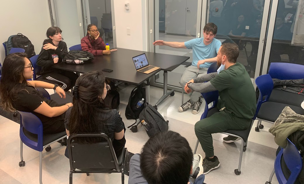 photo of students at a large table