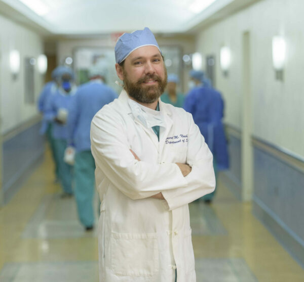 Dr. Garrett Nash professional photo in surgical attire 