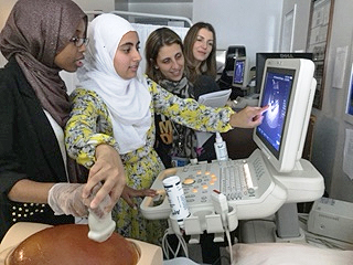 Group of students watching Sonogram deno.