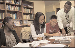 photo of 4 people around a table