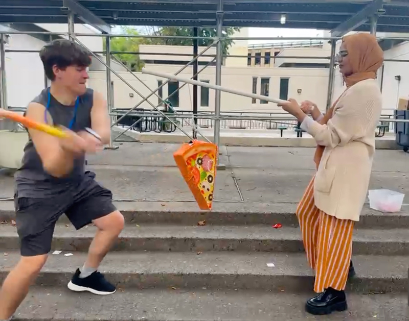 pizza pinata being hit