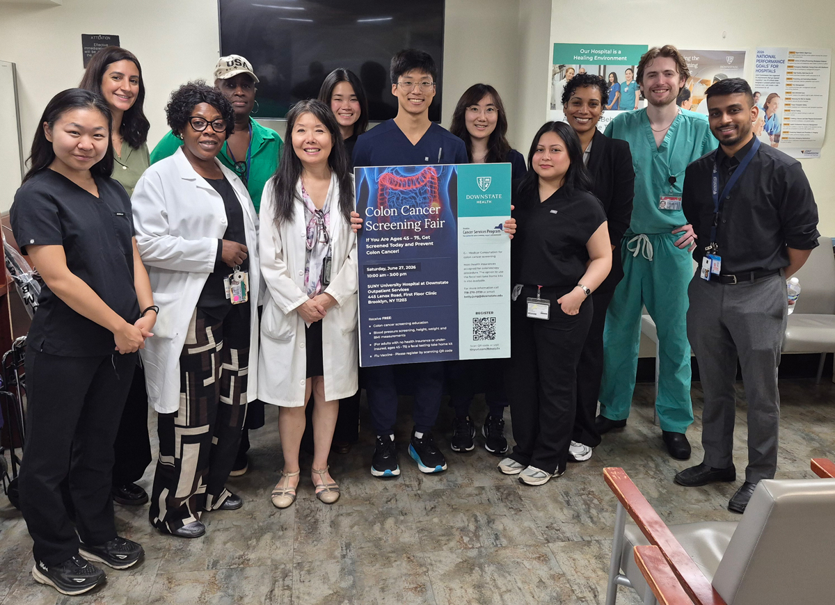 group photo of participants holding up a poster
