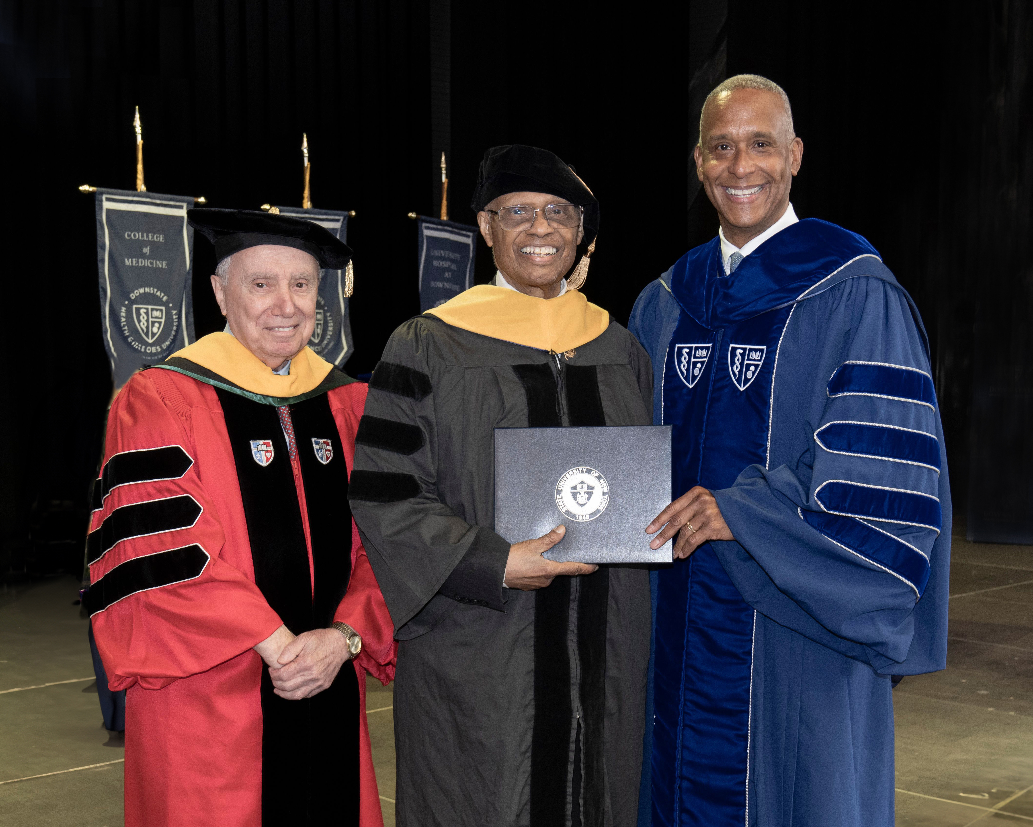 Dr. Callender (center), Dr. Wayne J. Riley (to his left), and Dr. Pascale Imperato (in red). Photo Credit: SUNY Downstate Health Sciences University