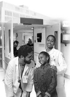 Doctor and nurse with child patient